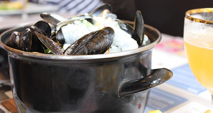 Plate of mussels and wine in Lille, France - restaurants in Lille
