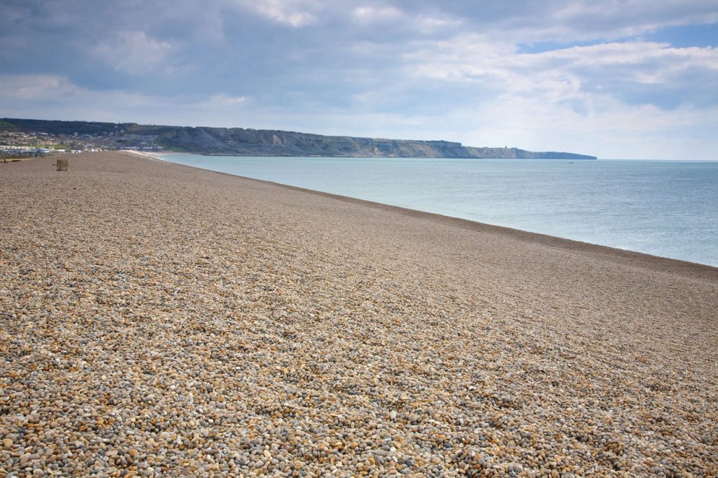 This image has an empty alt attribute; its file name is shutterstock_137043023_Chesil-Beach-1024x682.jpg