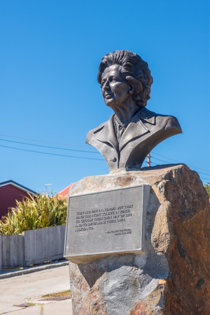 This image has an empty alt attribute; its file name is memorial_bust_Margret_thatcher_Stanley_Falkland_Islands_Shutterstock_Terence_Mendoza-683x1024.jpg