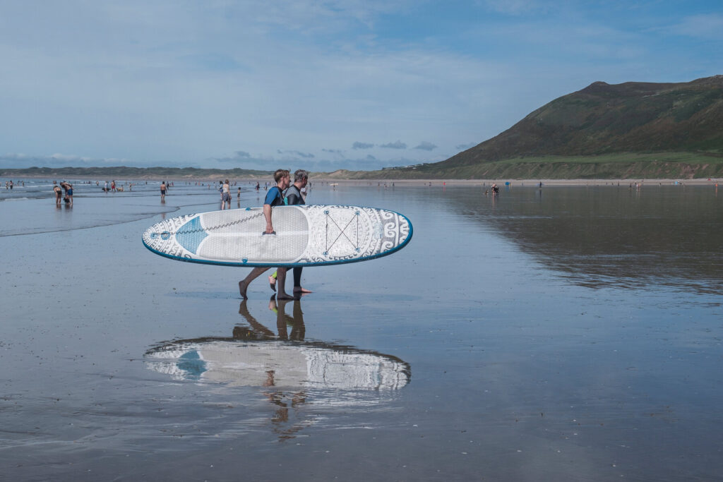 This image has an empty alt attribute; its file name is surfing_gower_peninsula_south_wales_andyparker72_shutterstock-1024x683.jpg