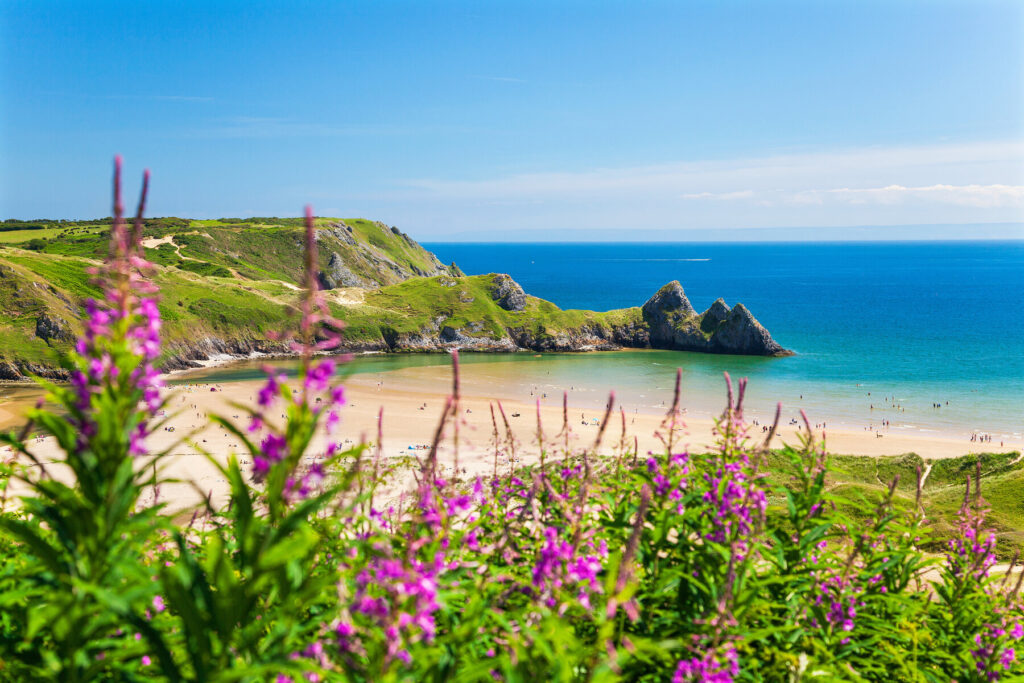 This image has an empty alt attribute; its file name is three_cliffs_bay_south_wales_Billy_Stock_shutterstock_-1024x683.jpg