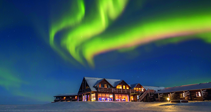 The northern lights shine above Hotel Rangá in Iceland. 