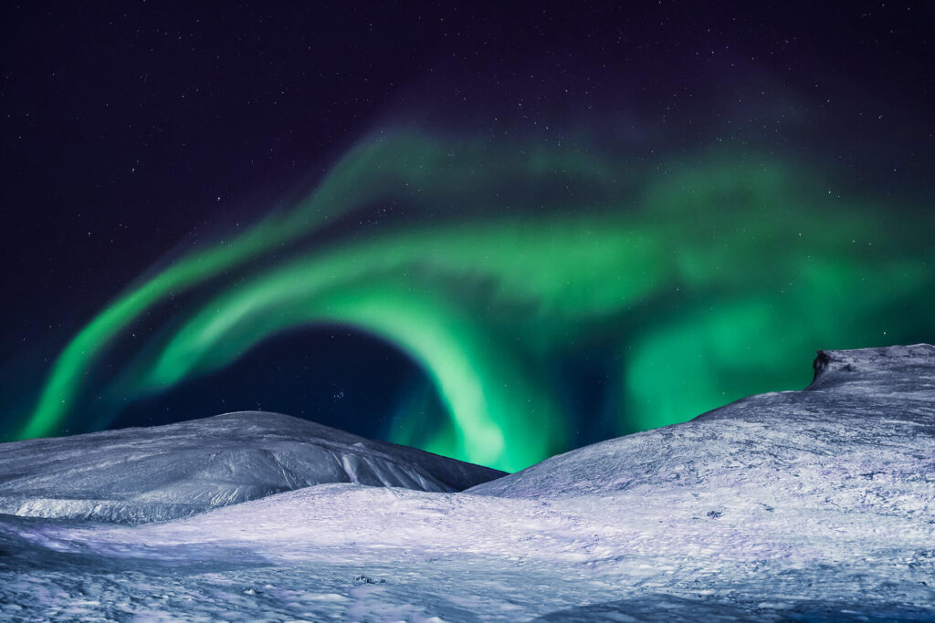 The aurora borealis can be seen above Svalbard. 