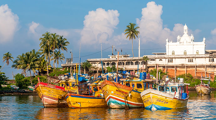 Boats sit in the harbour in Benton, Sri Lanka 