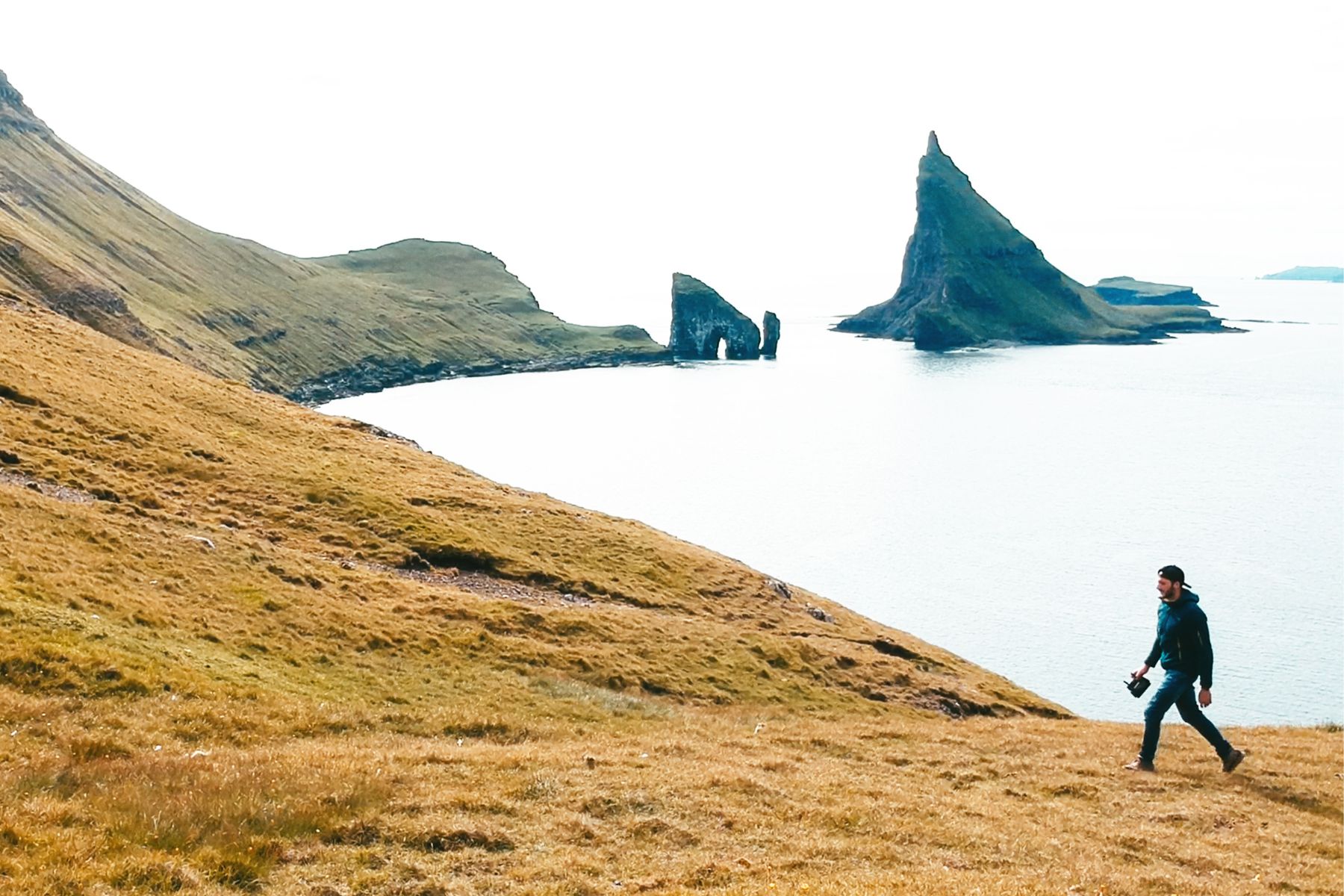 A man hiking through the Faroe Islands.