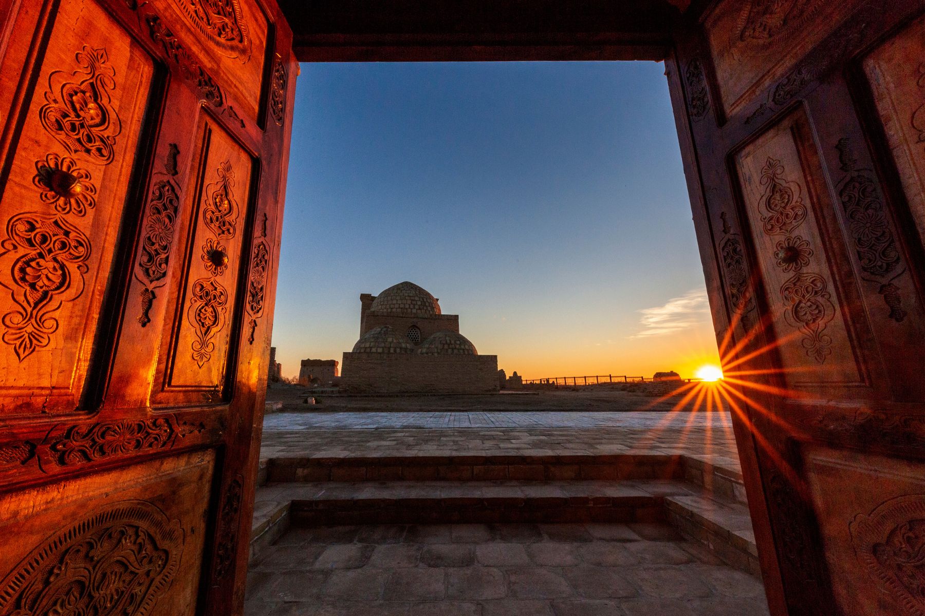 View of Mizdakhan Mausoleum through arches at sunset, Karakalpakstan