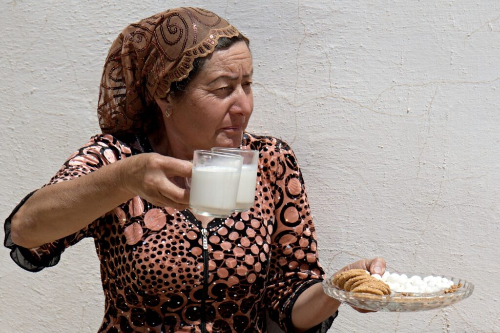 A woman selling camel milk  at the Ayaz Fort, Karakalpakstan