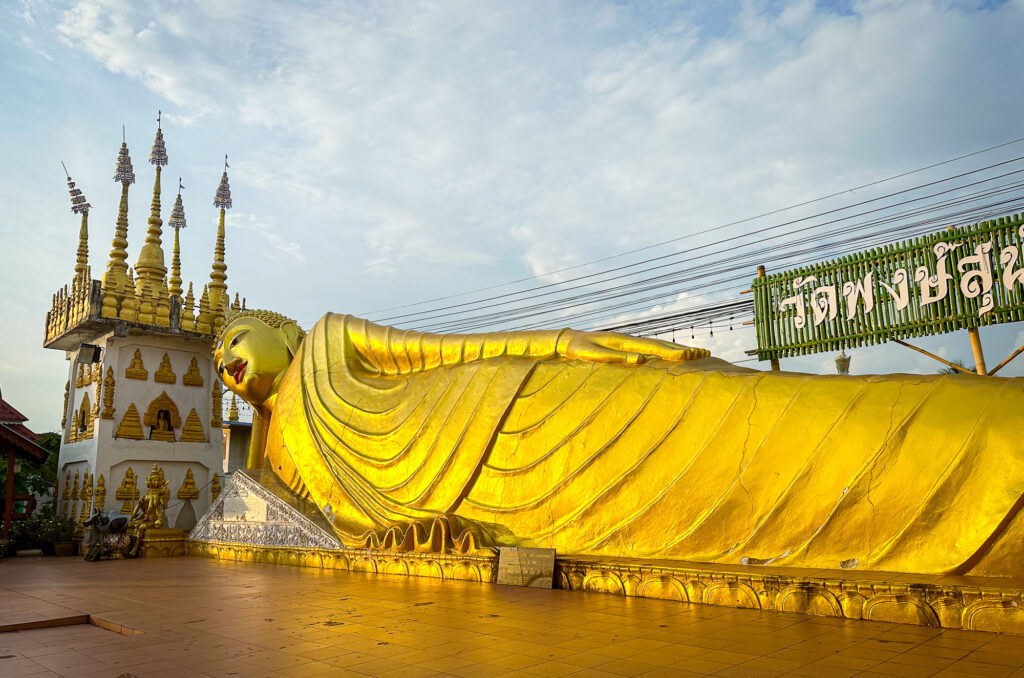 Reclining Buddha at sunset at Wat Phra Non in Phrae Thailand