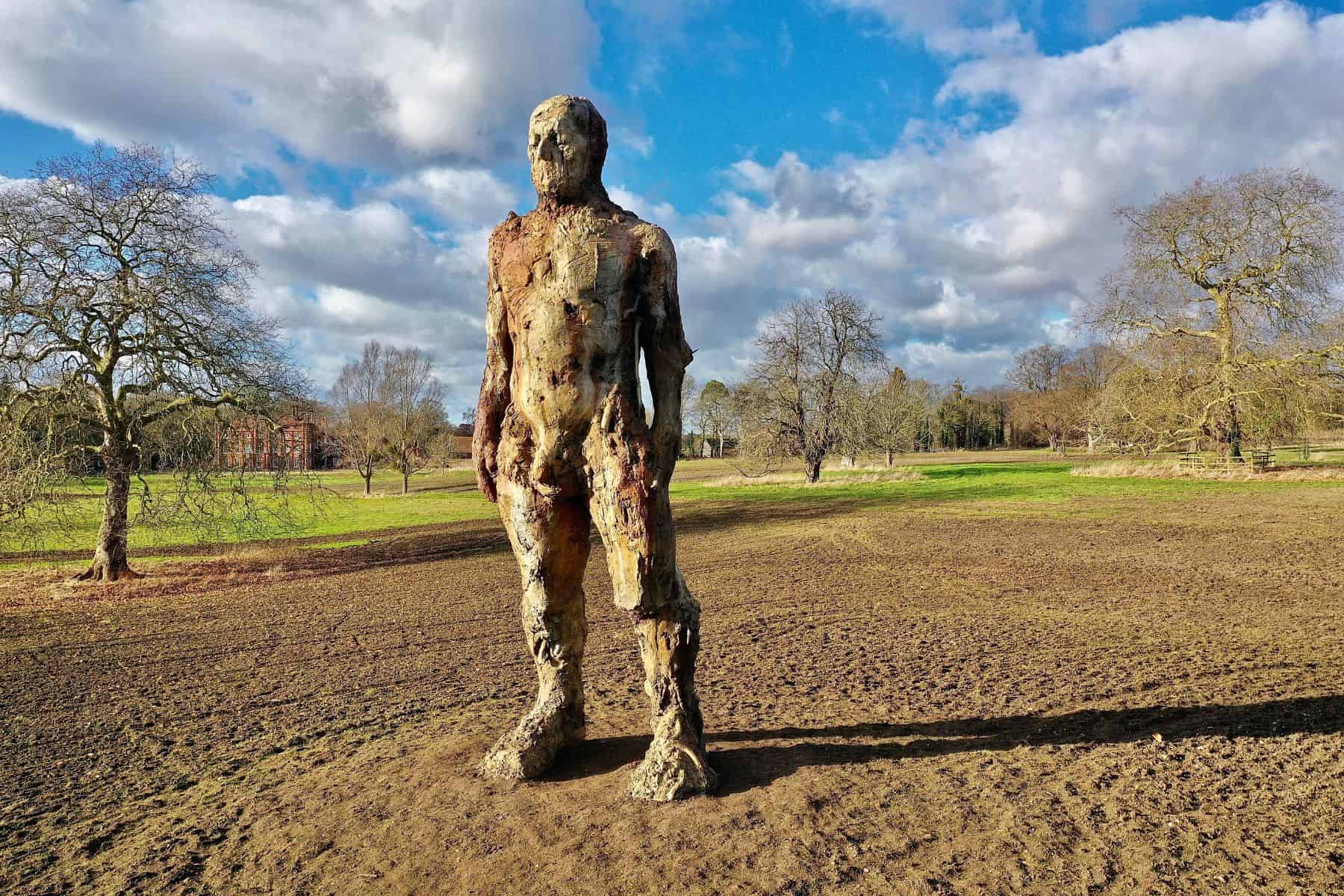 The Yoxford Giant standing in a field, Suffolk