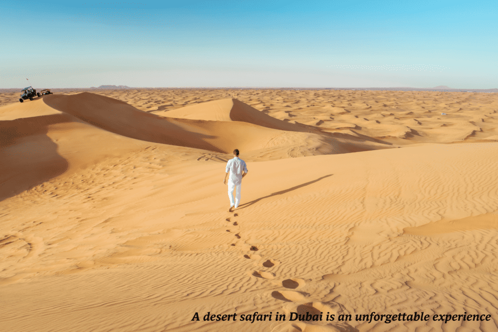 Man walks through the desert in Dubai 