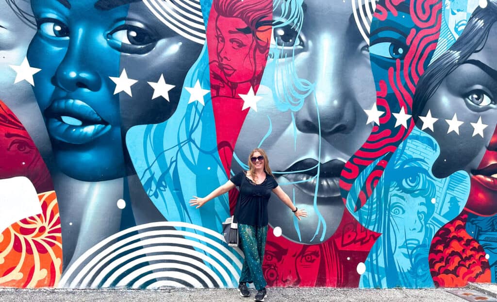Abigail King in front of street art in Wynwood Miami Florida 