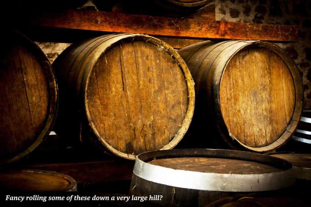 Wine barrels stacked up in cellar 