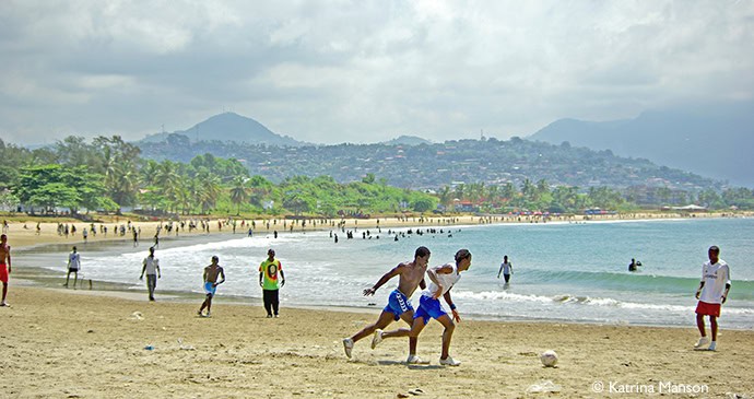 Mohamed Kallon playing football on Lumley Beach in Sierra Leone 