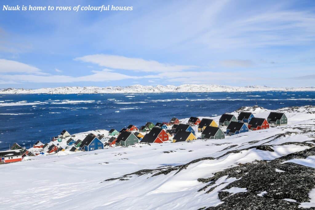 Rows of colourful houses along the coast in Nuuk, Greenland 