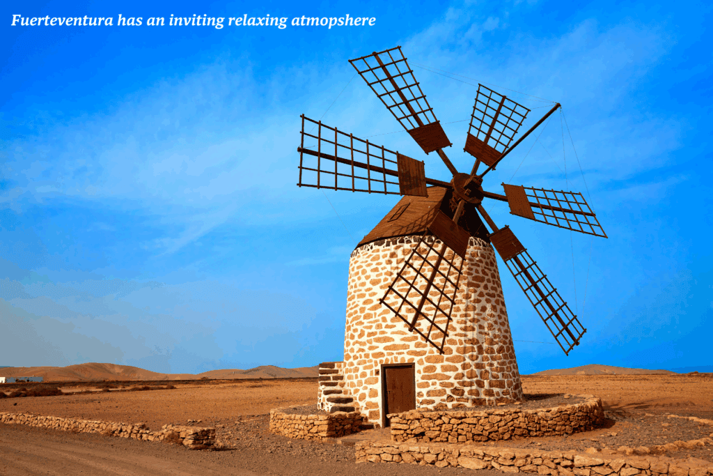 Windmill under a bright blue sky in Fuerteventura, Spain - is Fuerteventura good for families?