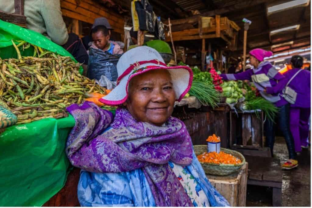 Woman at a fruit and vegetable market in Antsirabe, Madagascar - interesting facts about Madagascar