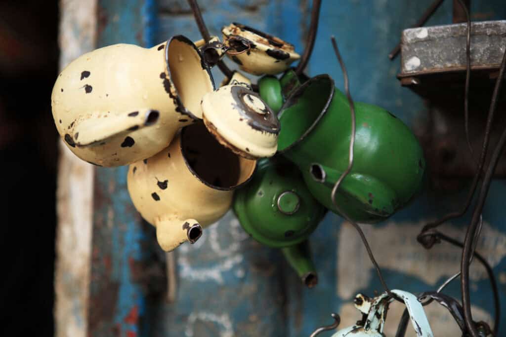 Traditional tea kettles hanging outside of a shop - what is it like to travel to Afghanistan?