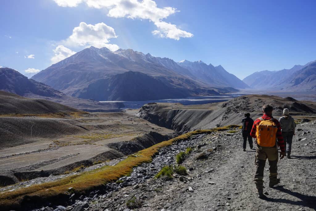 People walking along the Wakhn Corridor in Afghanistan. -what is it like to travel to Afghanistan?