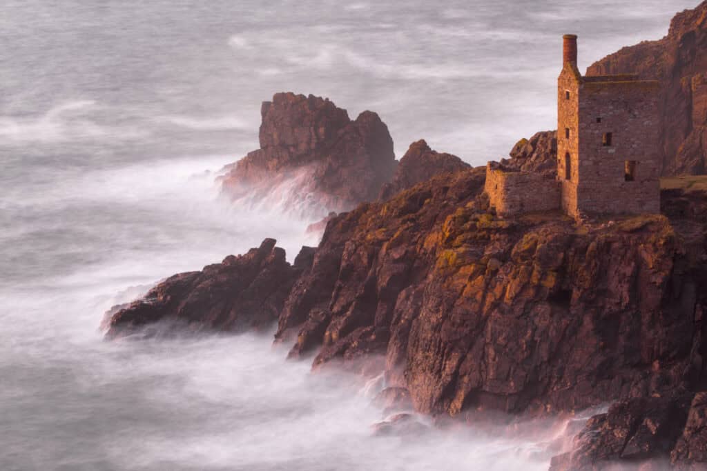 water crashing against the rocks in Botallack, Cornwall, UK - where to take photos in Britain