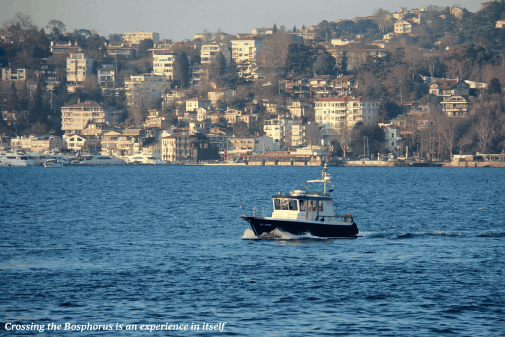 Small boat crossing the Bosphorus in Istanbul - off the beaten track in Istanbul