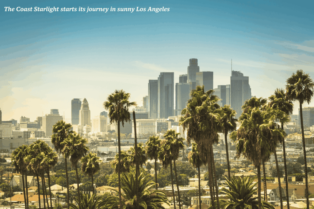 Dusk over Los Angeles skyscrapers and palm trees - best train rides in the USA