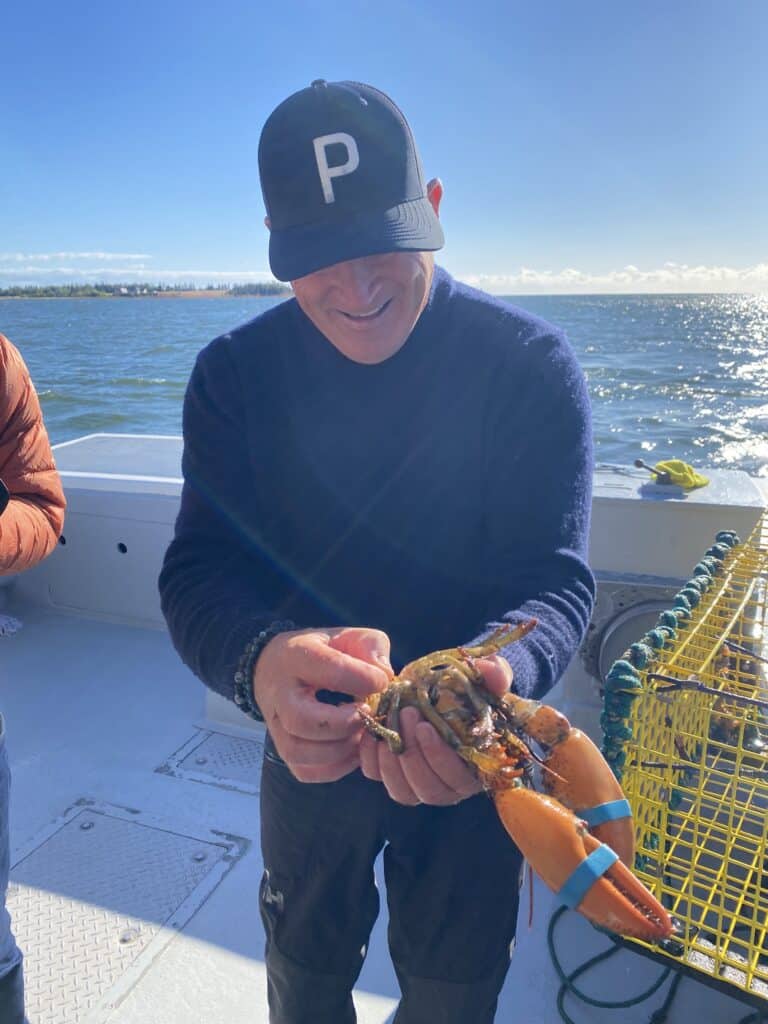 Captain Perry with a lobster on Prince Edward Island, Canada 