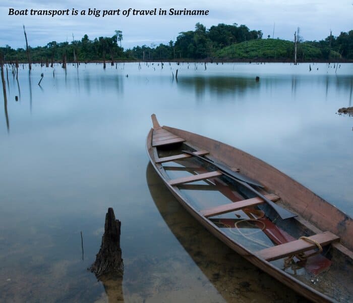 Old canoe filling with water on the river in Suriname
