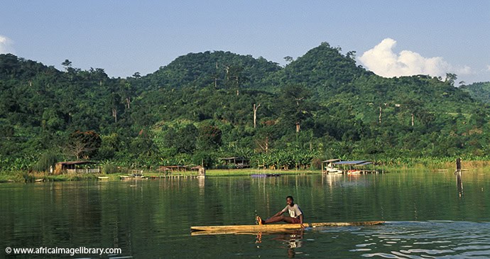 Man canoeing on Lake Bosomtwe in Ghana