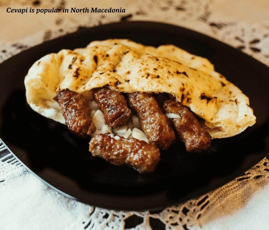Plate of cevapi in pita bread - traditional North Macedonian food