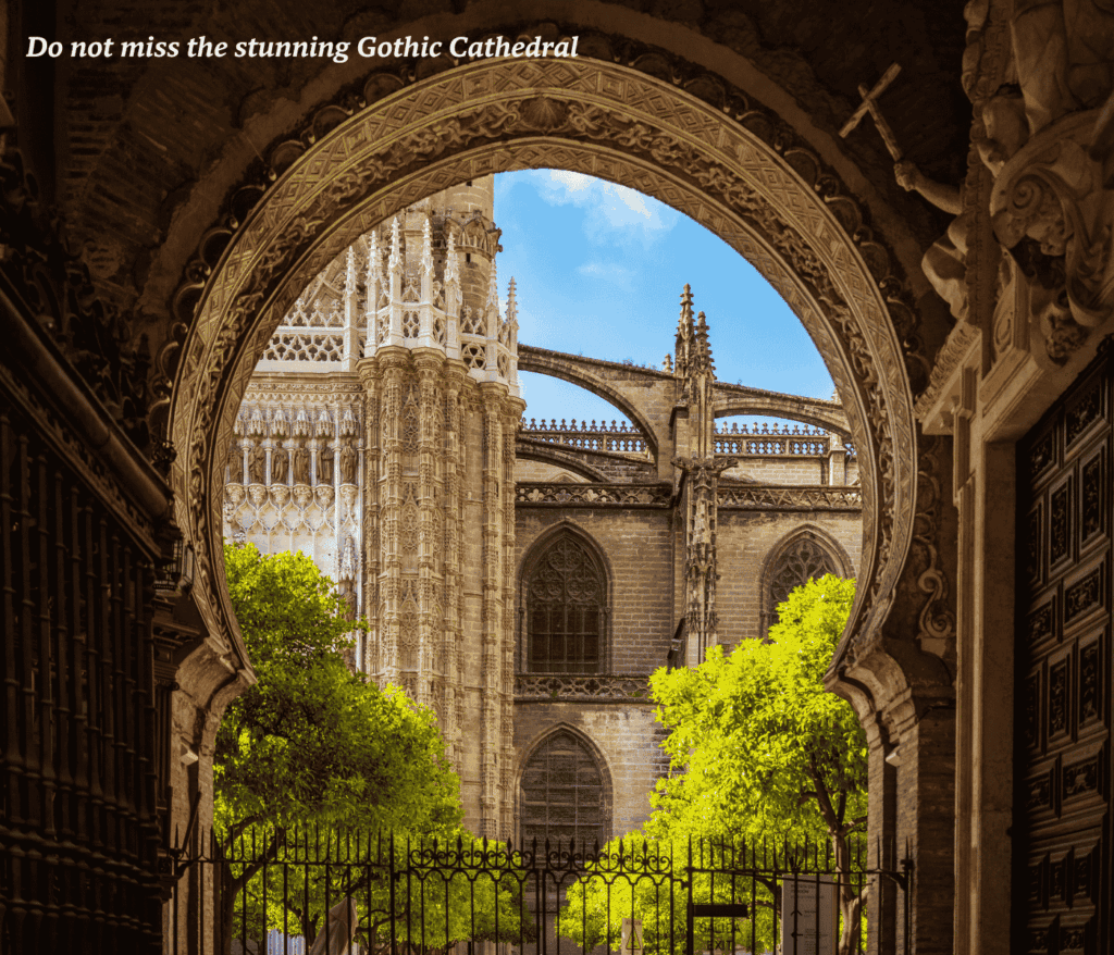 Seville Cathedral photographed through a Gothic archway in Seville, Spain