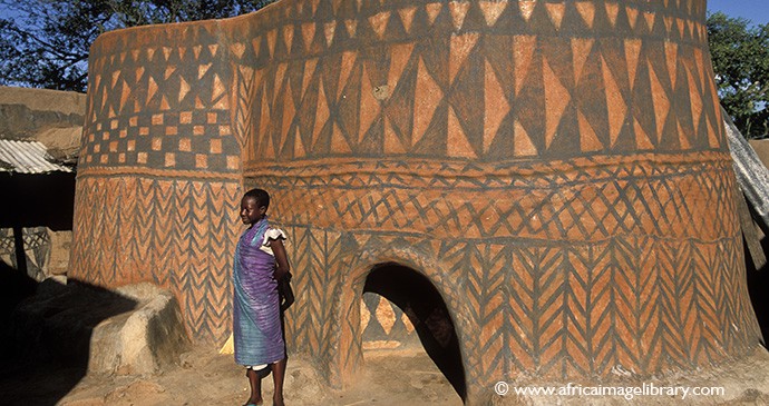 Man standing outside the palace of Paga Pio in Ghana