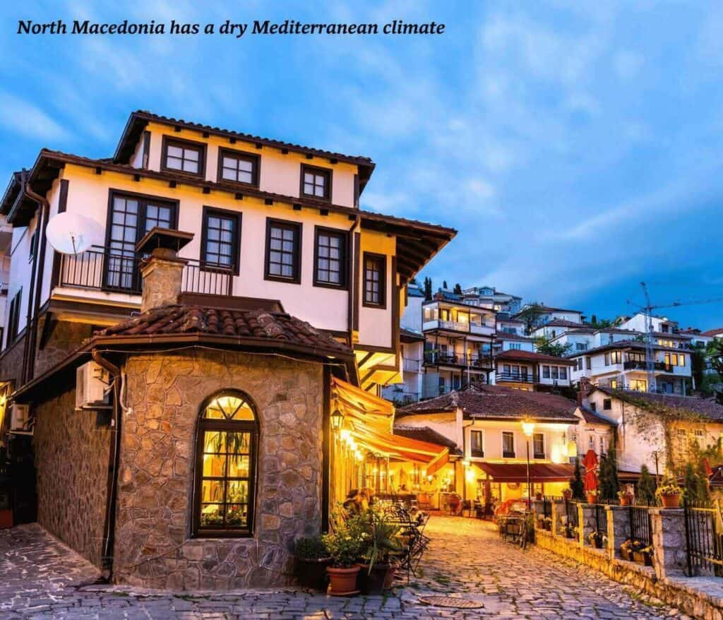 Traditional houses lit up at night in Ohrid, North Macedonia