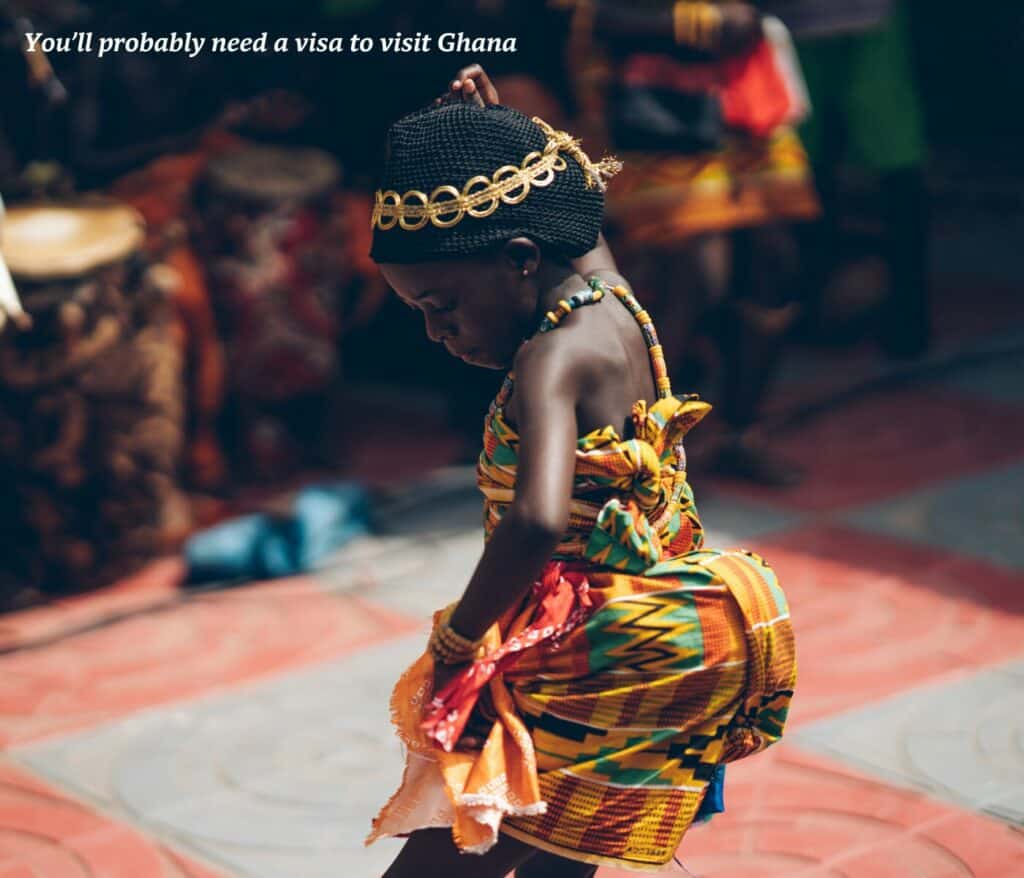 Woman dancing in traditional dress in Ghana