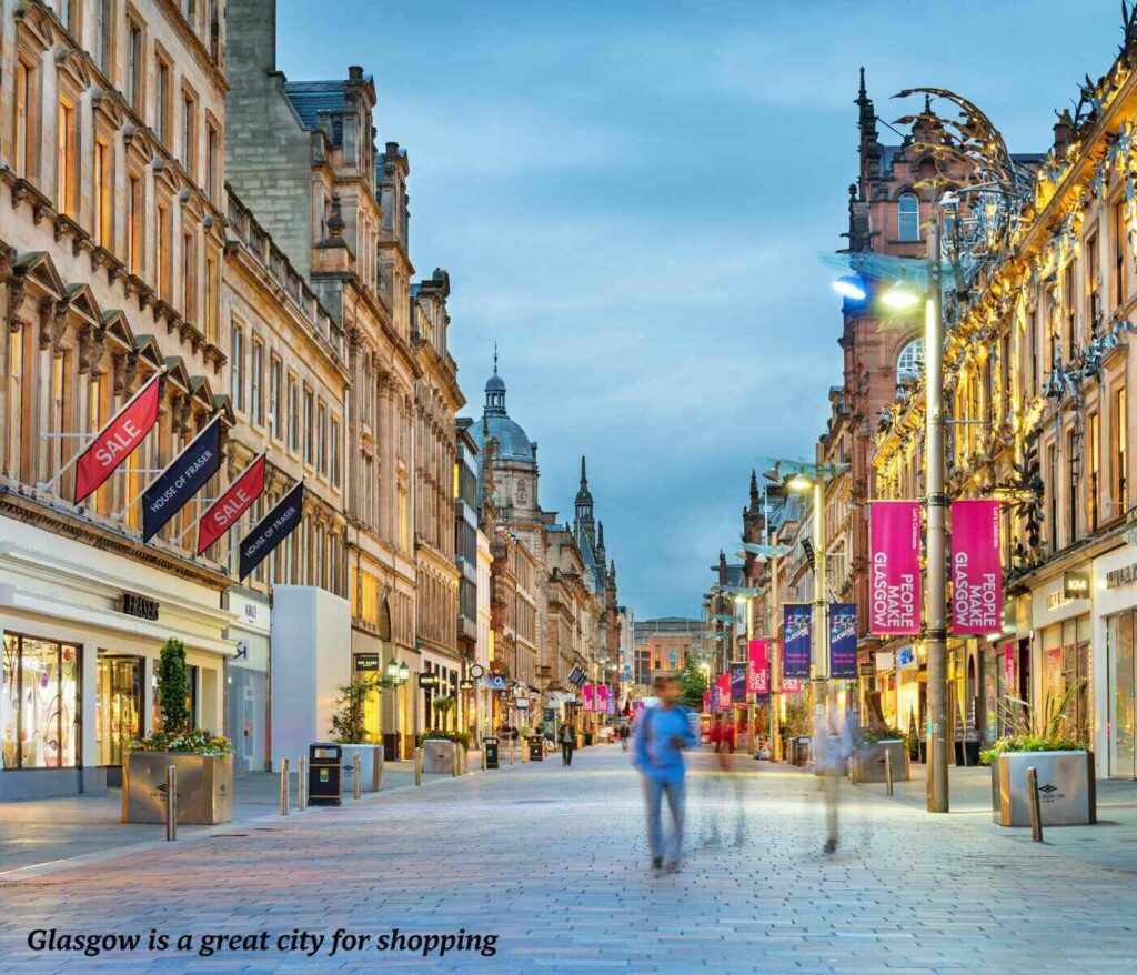 People walking along a busy shopping street in Glasgow at night