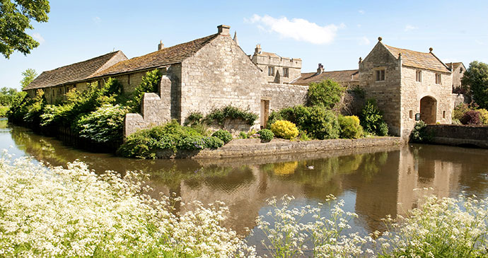 The moat at Markenfield Hall Yorkshire Dales England UK by Markenfield Hall
