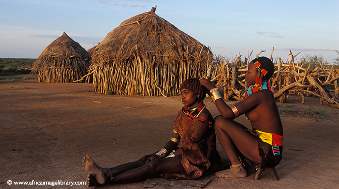 Hamer women applying ochre, South Omo, Ethiopia by Ariadne Van Zandbergen