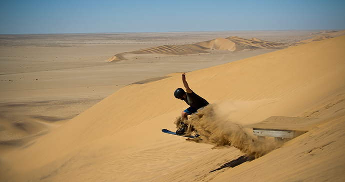 Sandboarding desert Namibia by Luke Price, Flickr