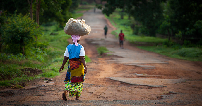 Woman walking Sierra Leone by robertonencini Shutterstock