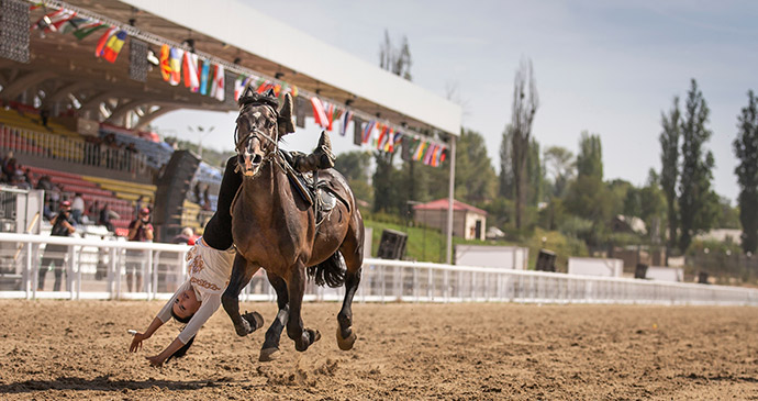 horseback gymnastics, World Nomad Games, Kyrgyzstan by Katiekk, Shutterstock