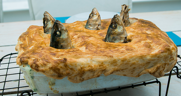 Stargazy Pie Mousehole Cornwall England UK by Davis Dorss Shutterstock