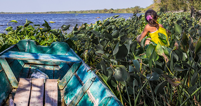 girl by fisherman' s boat by Julian peters, Shutterstock