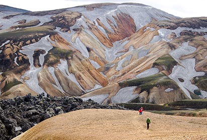 Trekkers on the lava field at Landmannalaugar by Nicram Sabod, Shutterstock