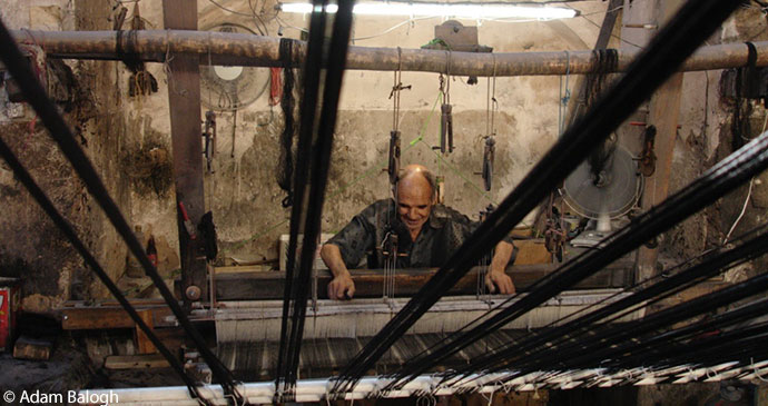 A traditional weaver in Kachan, Iran by Adam Balogh